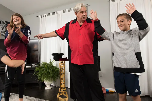 Children amazed at a birthday magic show