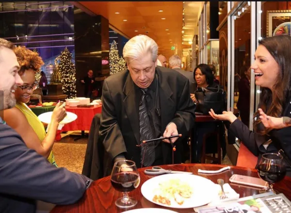 Magic Guy performing strolling close-up magic at a corporate function